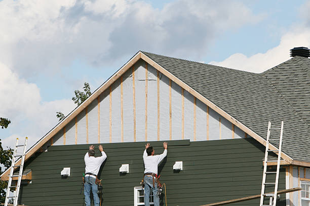 Professional Storm Damage Siding Repair technician working in Columbus, NC